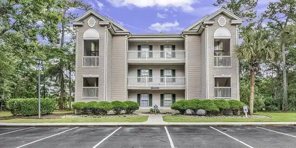 Image 3: View of building exterior with uncovered parking Image 3: View of building exterior with uncovered parking