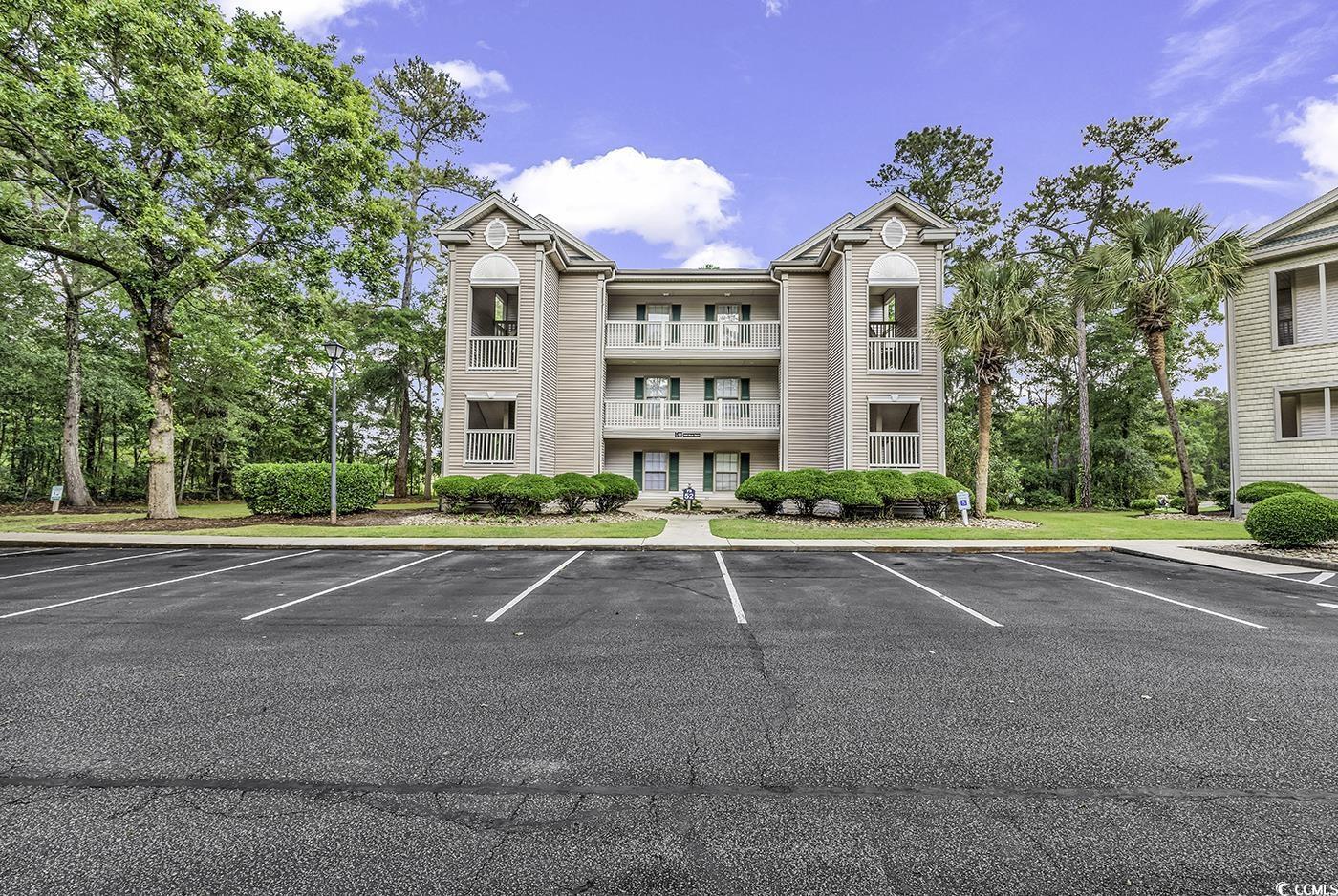 Image 4: View of property with uncovered parking
