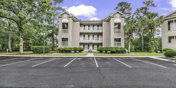 Image 4: View of property with uncovered parking Image 4: View of property with uncovered parking