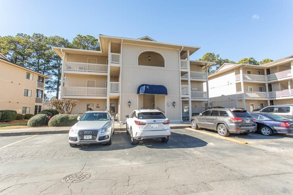 Image 2: View of apartment building / complex with uncovere