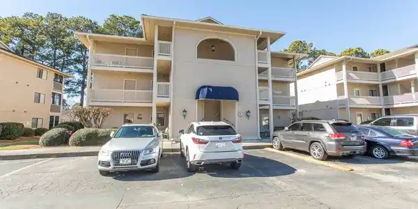 Image 2: View of apartment building / complex with uncovere