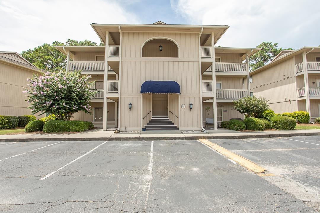 Image 3: View of apartment building / complex with uncovere