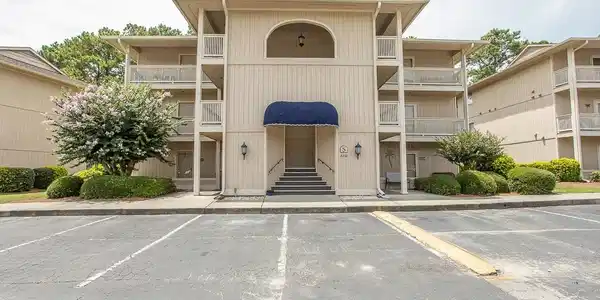 Image 3: View of apartment building / complex with uncovere