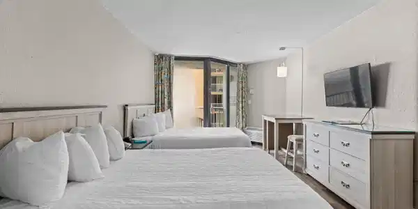 Image 4: Bedroom featuring a textured wall, dark wood finis