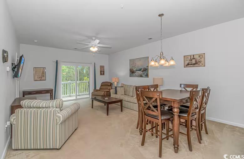 Image 4: Dining room featuring ceiling fan, light carpet, a Image 4: Dining room featuring ceiling fan, light carpet, a