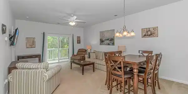 Image 4: Dining room featuring ceiling fan, light carpet, a Image 4: Dining room featuring ceiling fan, light carpet, a
