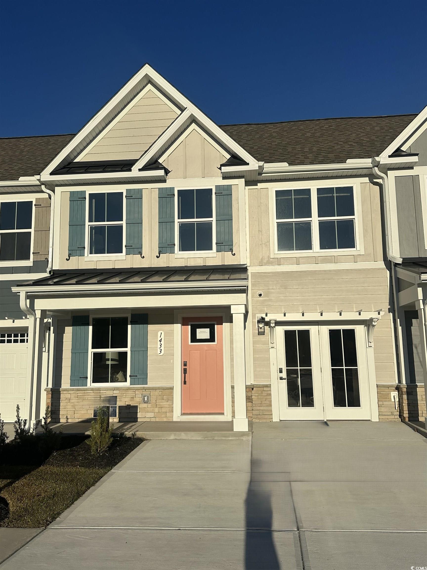 Image 1: Craftsman house featuring stone siding, a standing Image 1: Craftsman house featuring stone siding, a standing