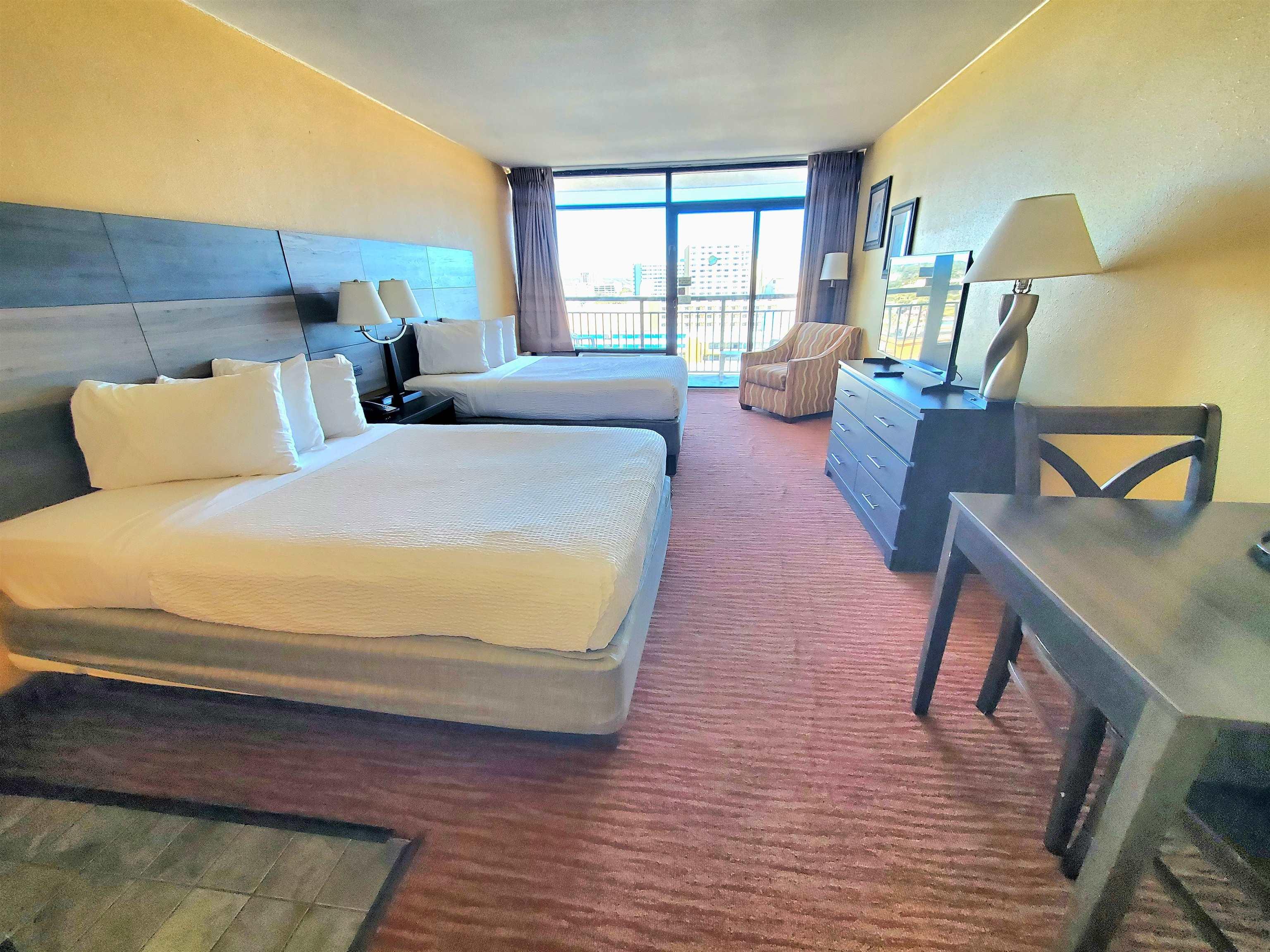 Image 4: Bedroom featuring access to outside, a wall of win Image 4: Bedroom featuring access to outside, a wall of win
