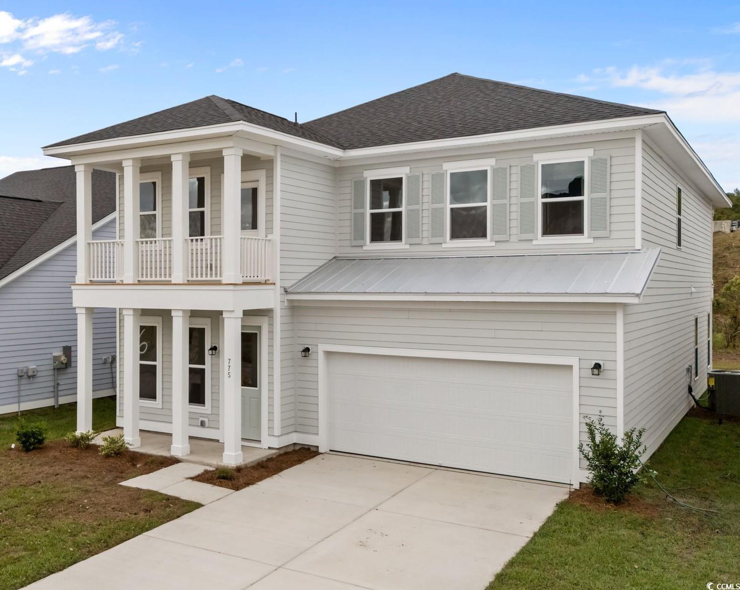 Image 1: View of front of home featuring covered porch, a s