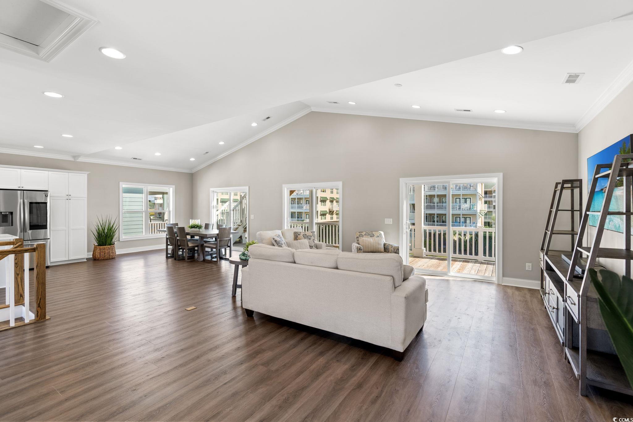 Image 4: Living room is spacious for several conversation a