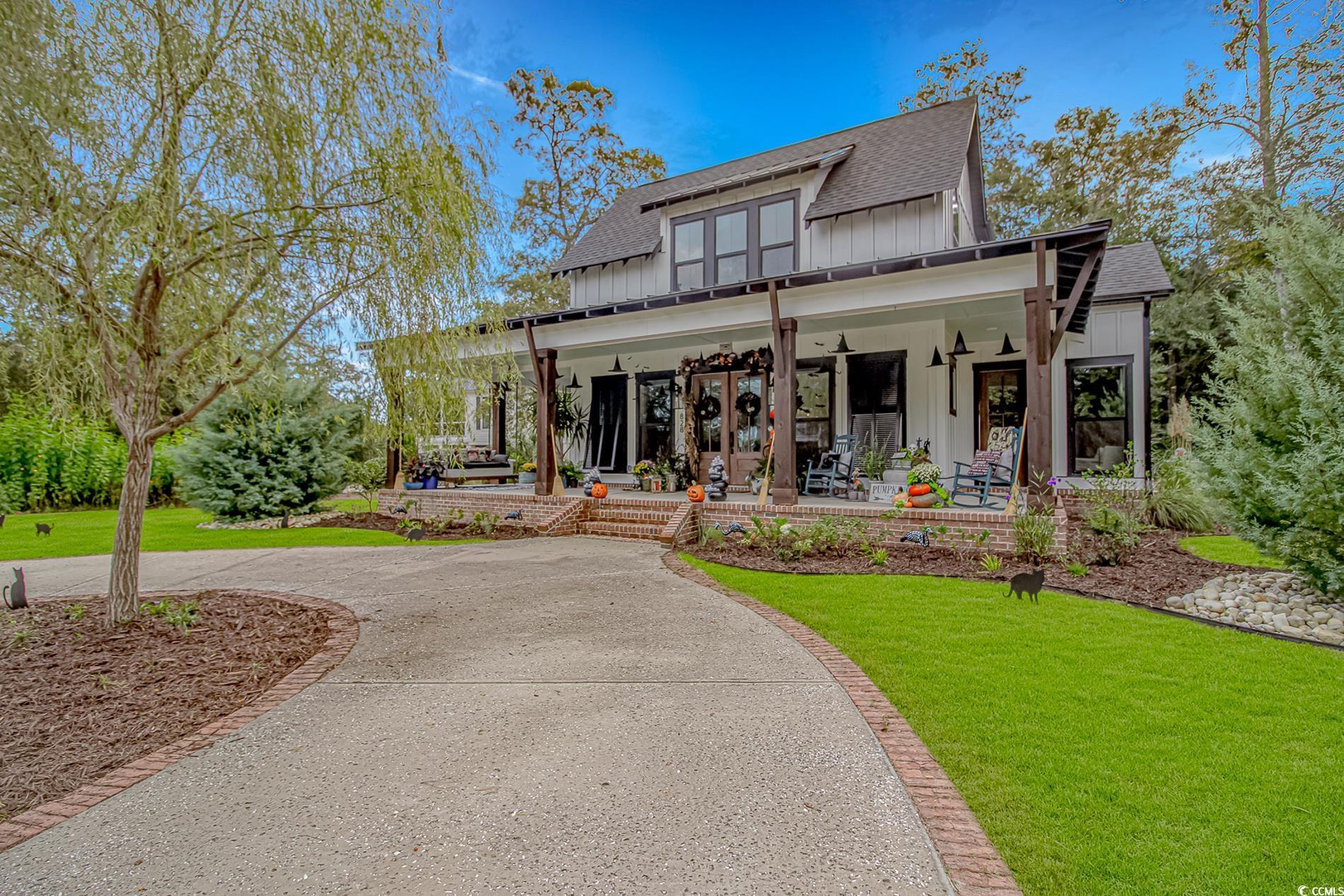 Image 1: Modern inspired farmhouse with board and batten si Image 1: Modern inspired farmhouse with board and batten si