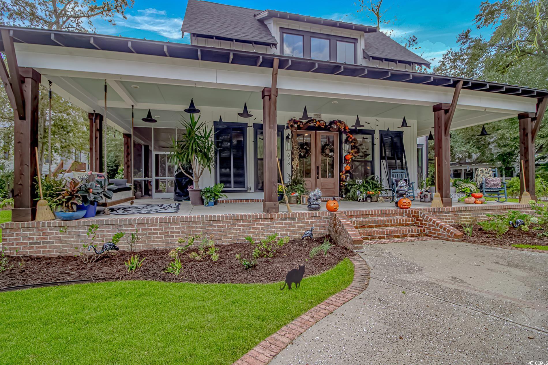 Image 3: Rear view of house featuring a porch, a shingled r Image 3: Rear view of house featuring a porch, a shingled r