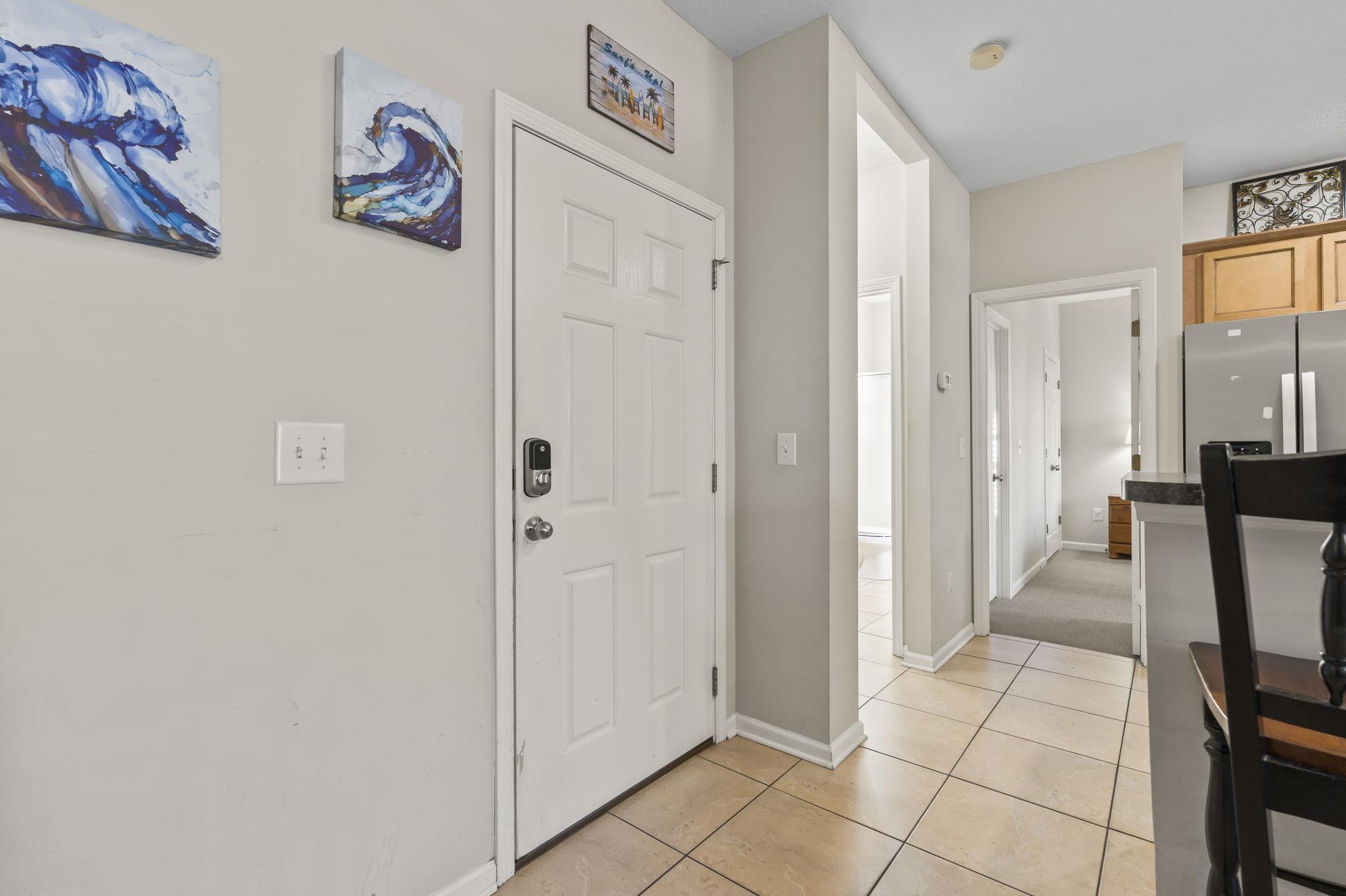 Image 4: Foyer featuring light tile patterned flooring and Image 4: Foyer featuring light tile patterned flooring and