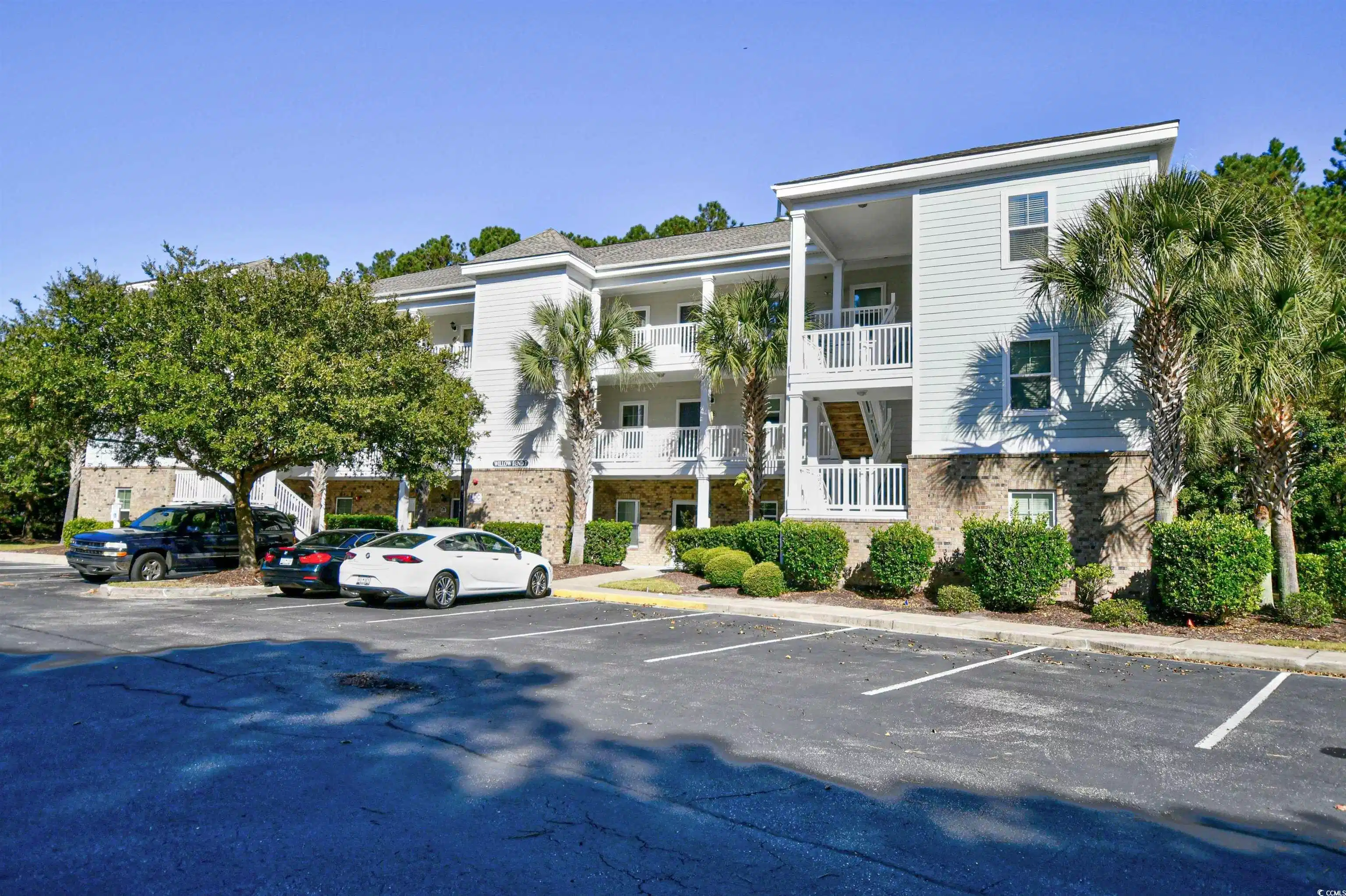 Image 1: View of building exterior with uncovered parking Image 1: View of building exterior with uncovered parking