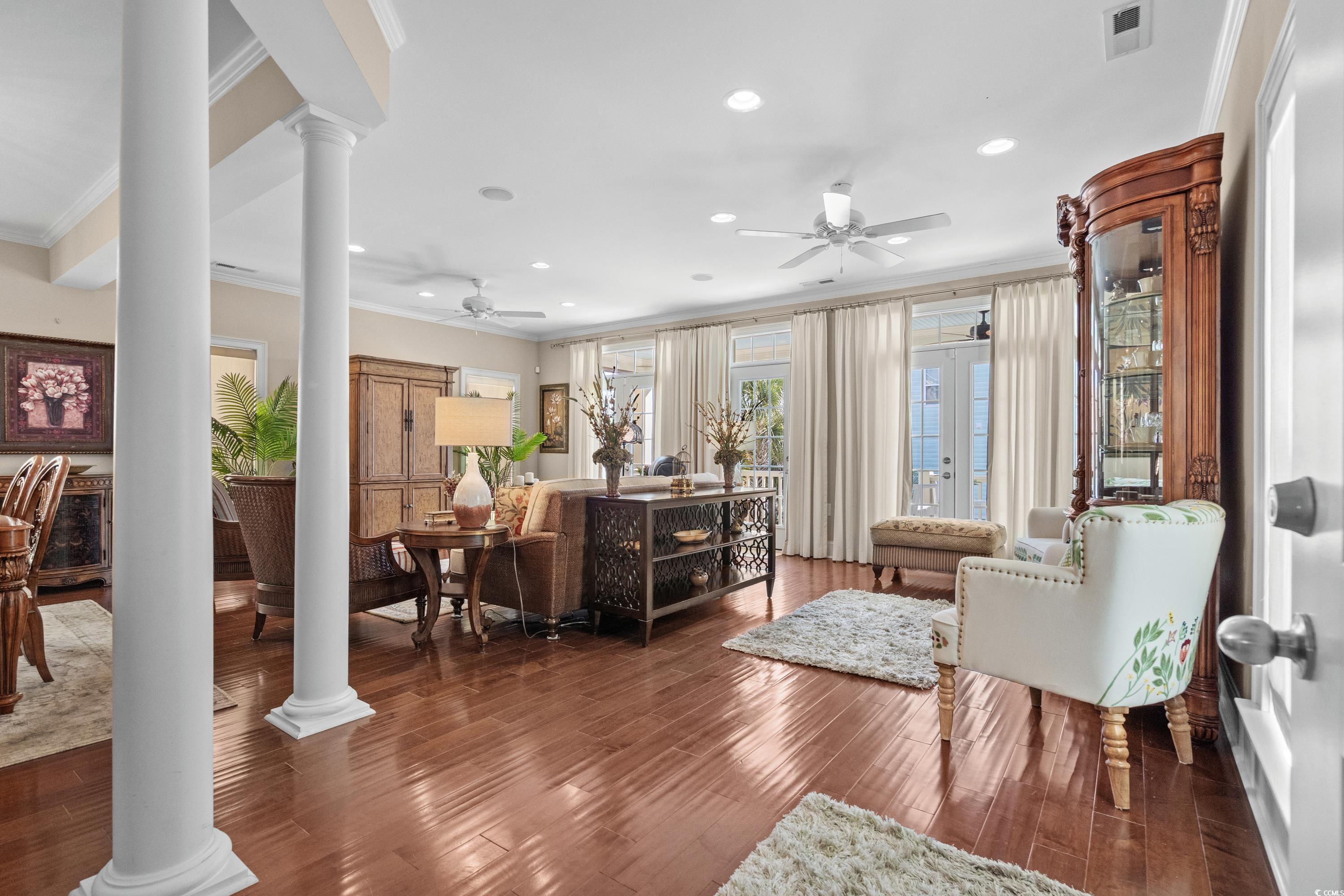 Image 3: Living room featuring ornamental molding, ornate c