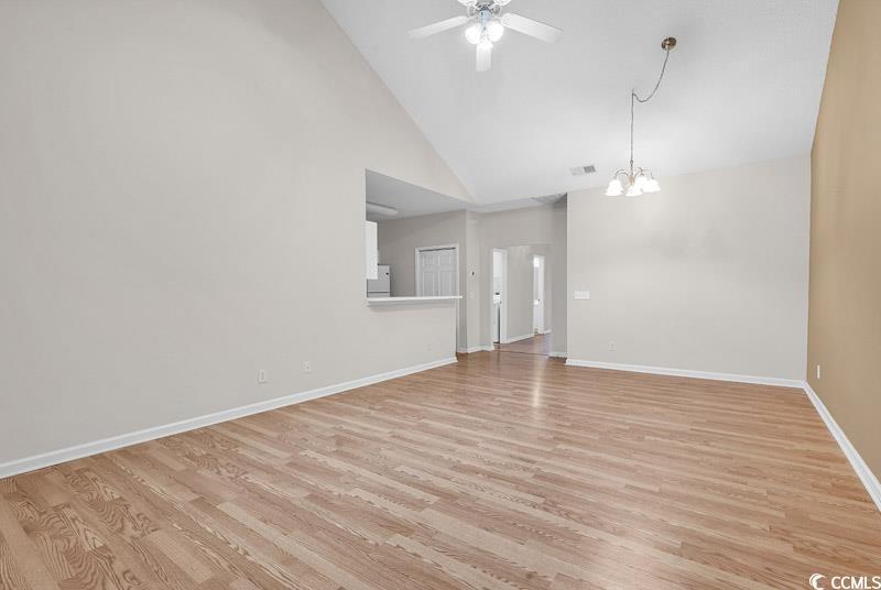 Image 4: Unfurnished living room featuring ceiling fan with