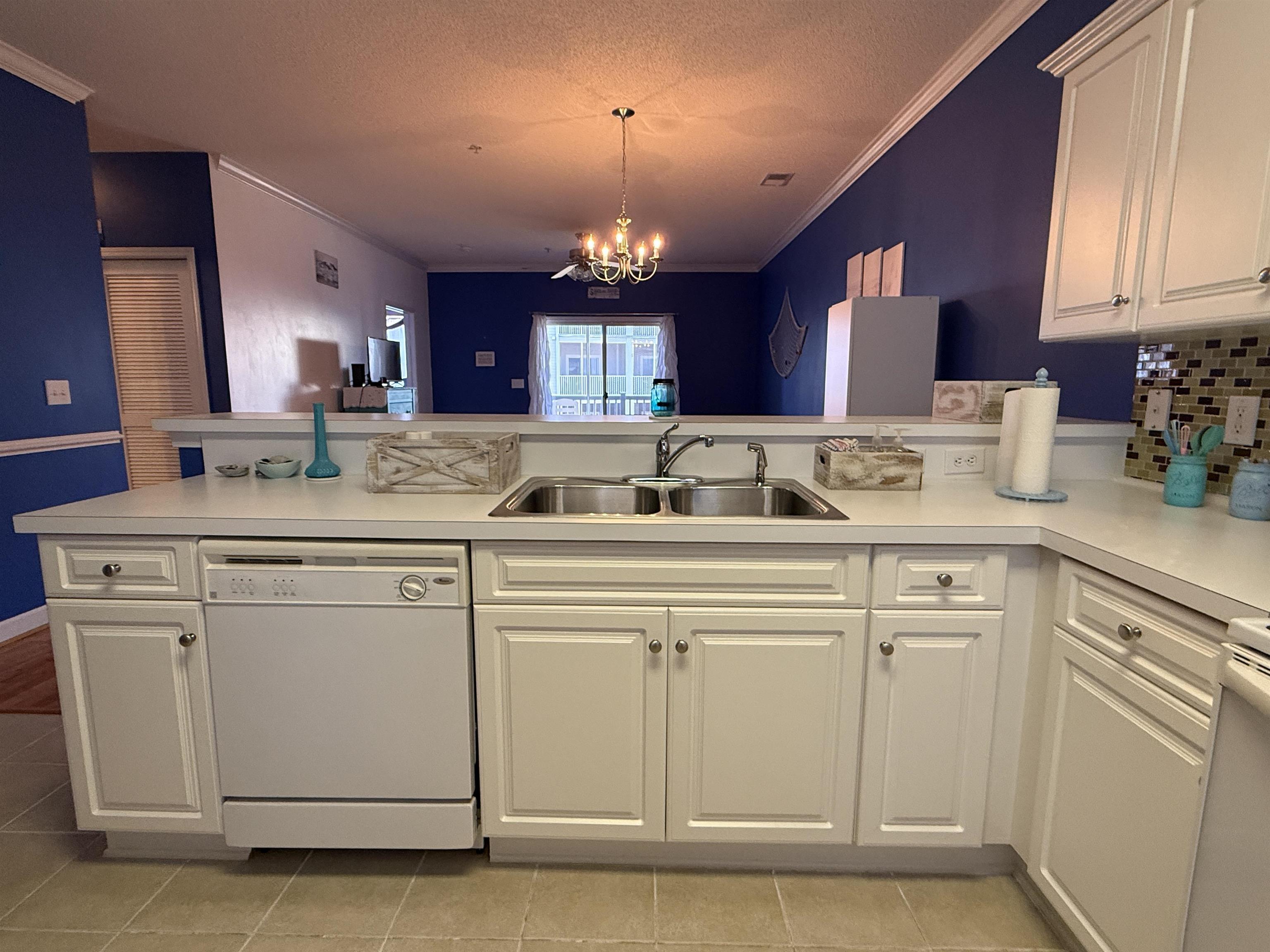 Image 2: Kitchen featuring crown molding, light countertops Image 2: Kitchen featuring crown molding, light countertops