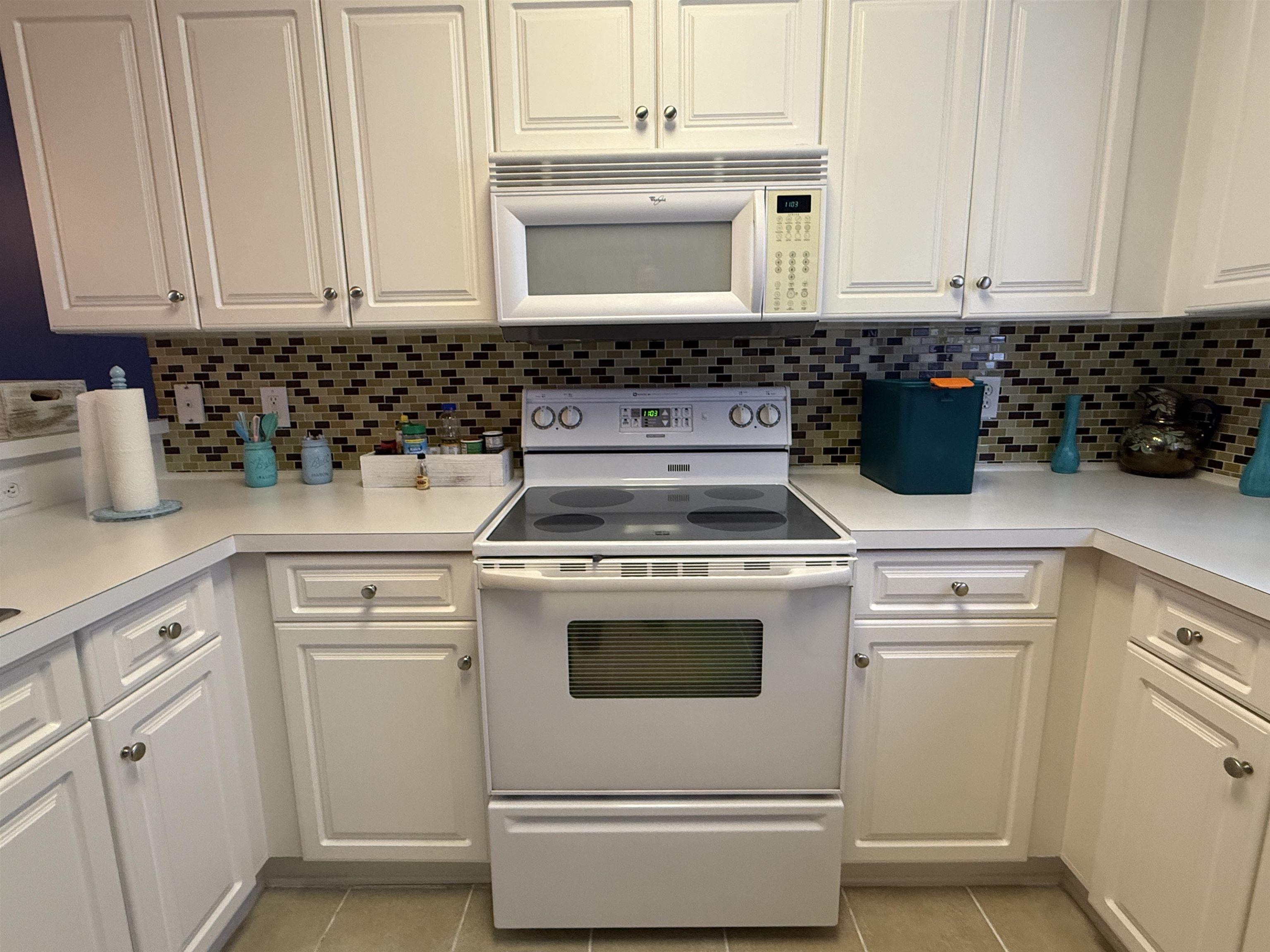 Image 3: Kitchen featuring white appliances, white cabinets Image 3: Kitchen featuring white appliances, white cabinets