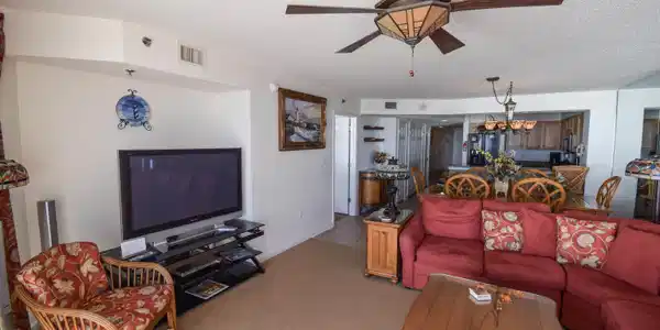 Image 2: Living room with ceiling fan with notable chandeli Image 2: Living room with ceiling fan with notable chandeli