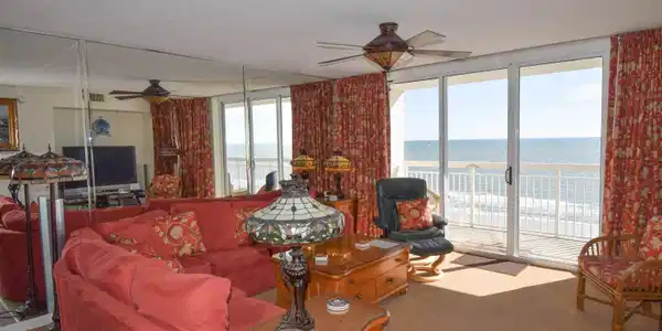 Image 3: Carpeted living room featuring floor to ceiling wi Image 3: Carpeted living room featuring floor to ceiling wi