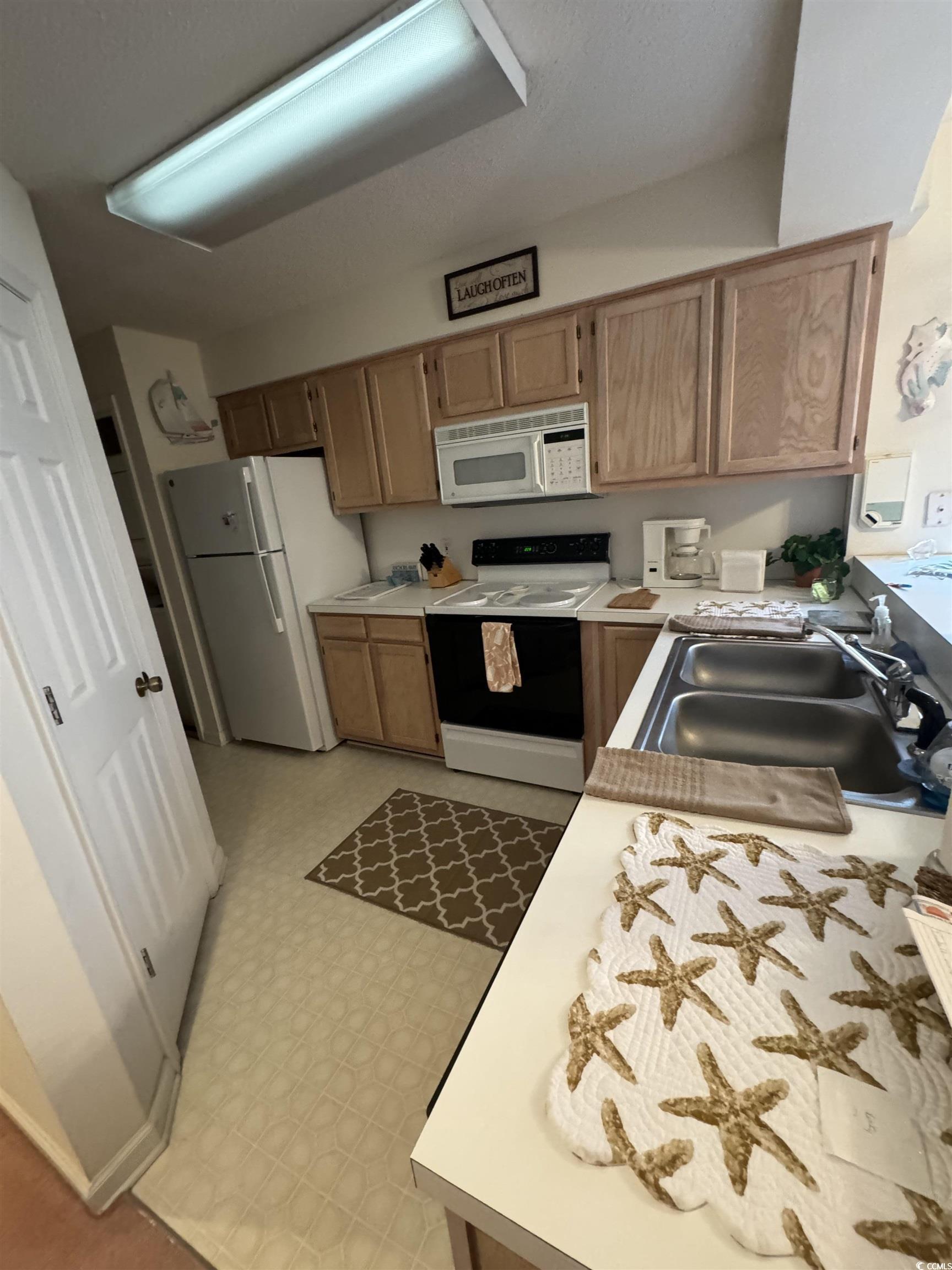 Image 4: Kitchen featuring light countertops, white applian Image 4: Kitchen featuring light countertops, white applian
