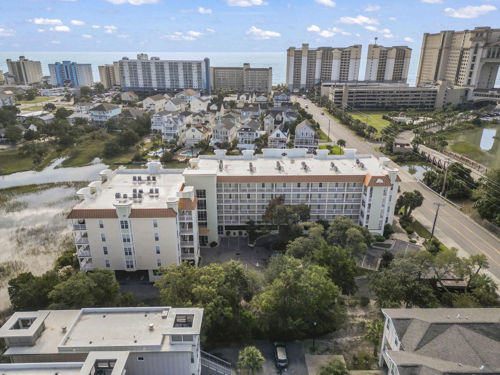 Image 2: View of urban area with apartment complex and a la