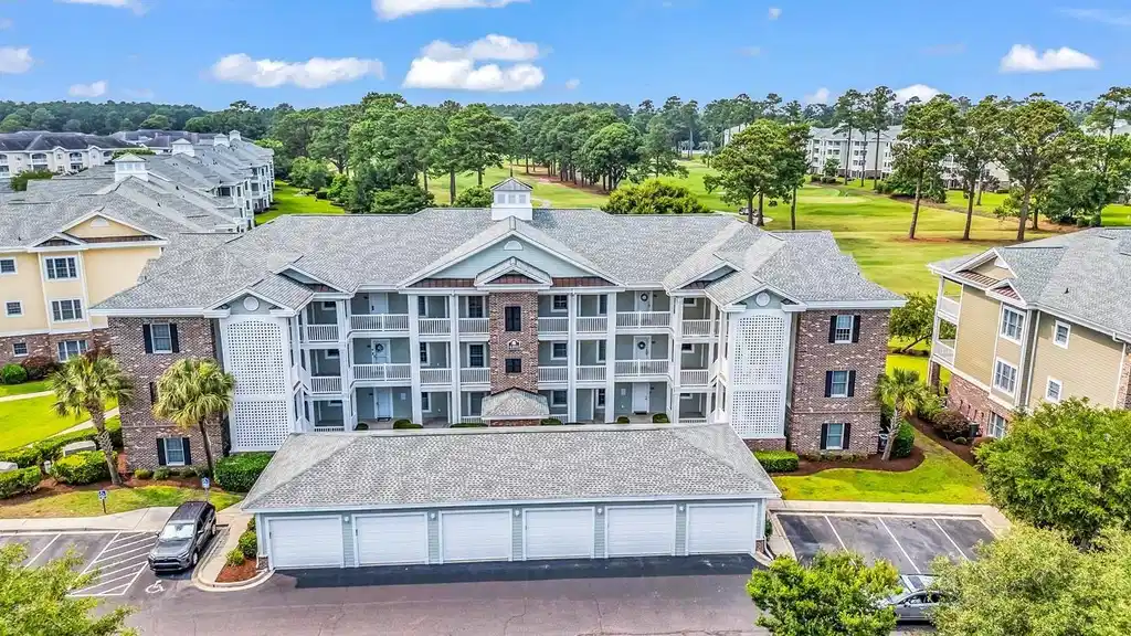 Image 1: Bird's eye view of apartment complex and a local g Image 1: Bird's eye view of apartment complex and a local g