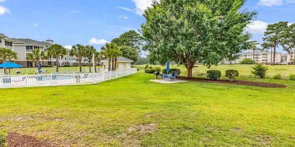 Image 2: View of yard with a patio and a community pool Image 2: View of yard with a patio and a community pool