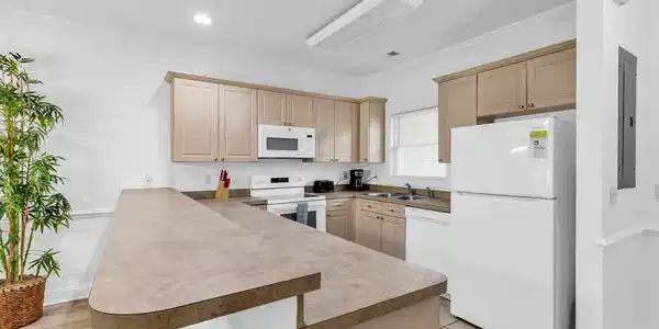 Image 4: Kitchen featuring white appliances, a breakfast ba Image 4: Kitchen featuring white appliances, a breakfast ba