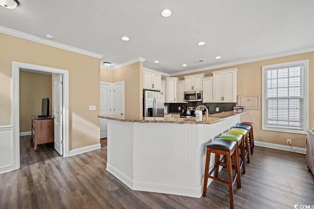 Image 4: Kitchen featuring light stone counters, stainless Image 4: Kitchen featuring light stone counters, stainless