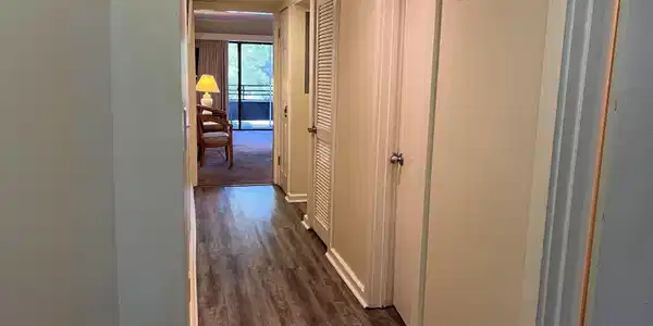 Image 2: Hall with dark wood-type flooring and baseboards Image 2: Hall with dark wood-type flooring and baseboards