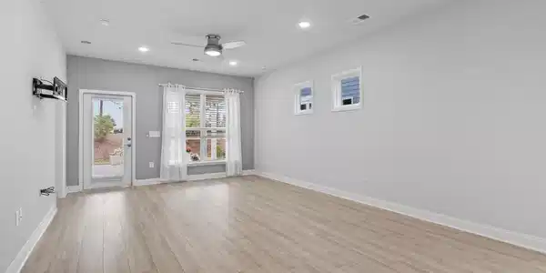 Image 3: Living/dining/kitchen room with light wood finishe Image 3: Living/dining/kitchen room with light wood finishe
