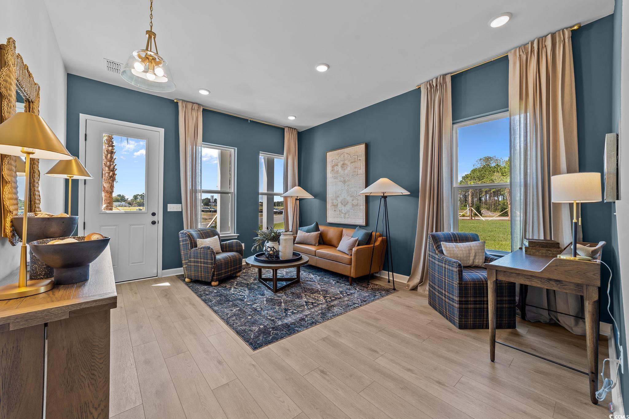 Image 2: Living area featuring light wood-style floors and Image 2: Living area featuring light wood-style floors and