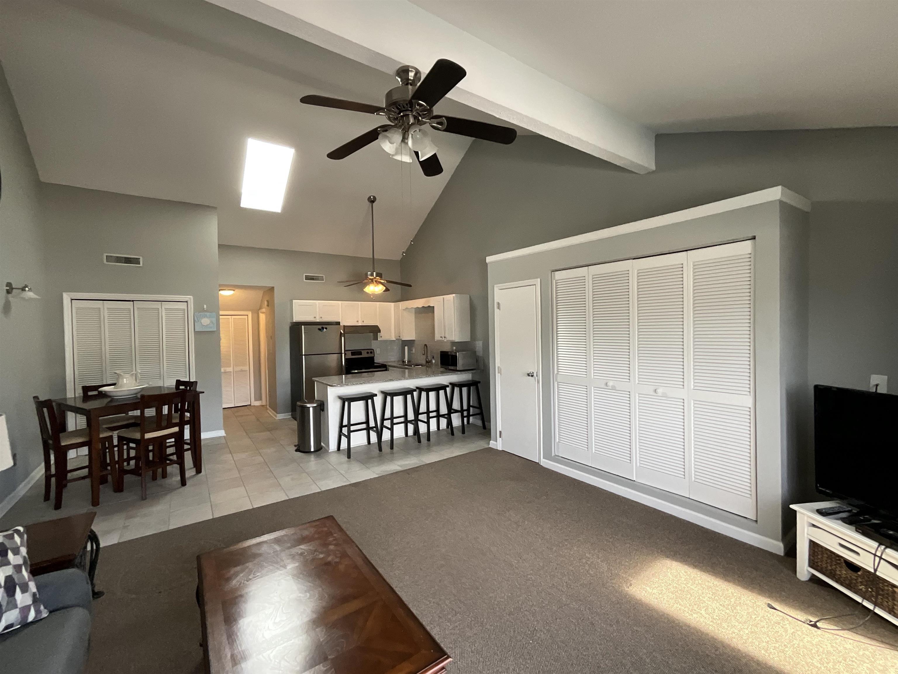 Image 2: Living room with high vaulted ceiling, a ceiling f Image 2: Living room with high vaulted ceiling, a ceiling f