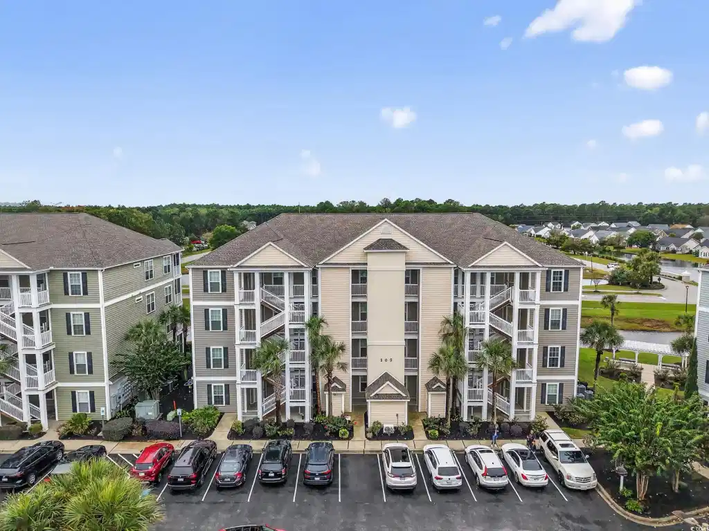 Image 1: View of apartment building / complex with uncovere