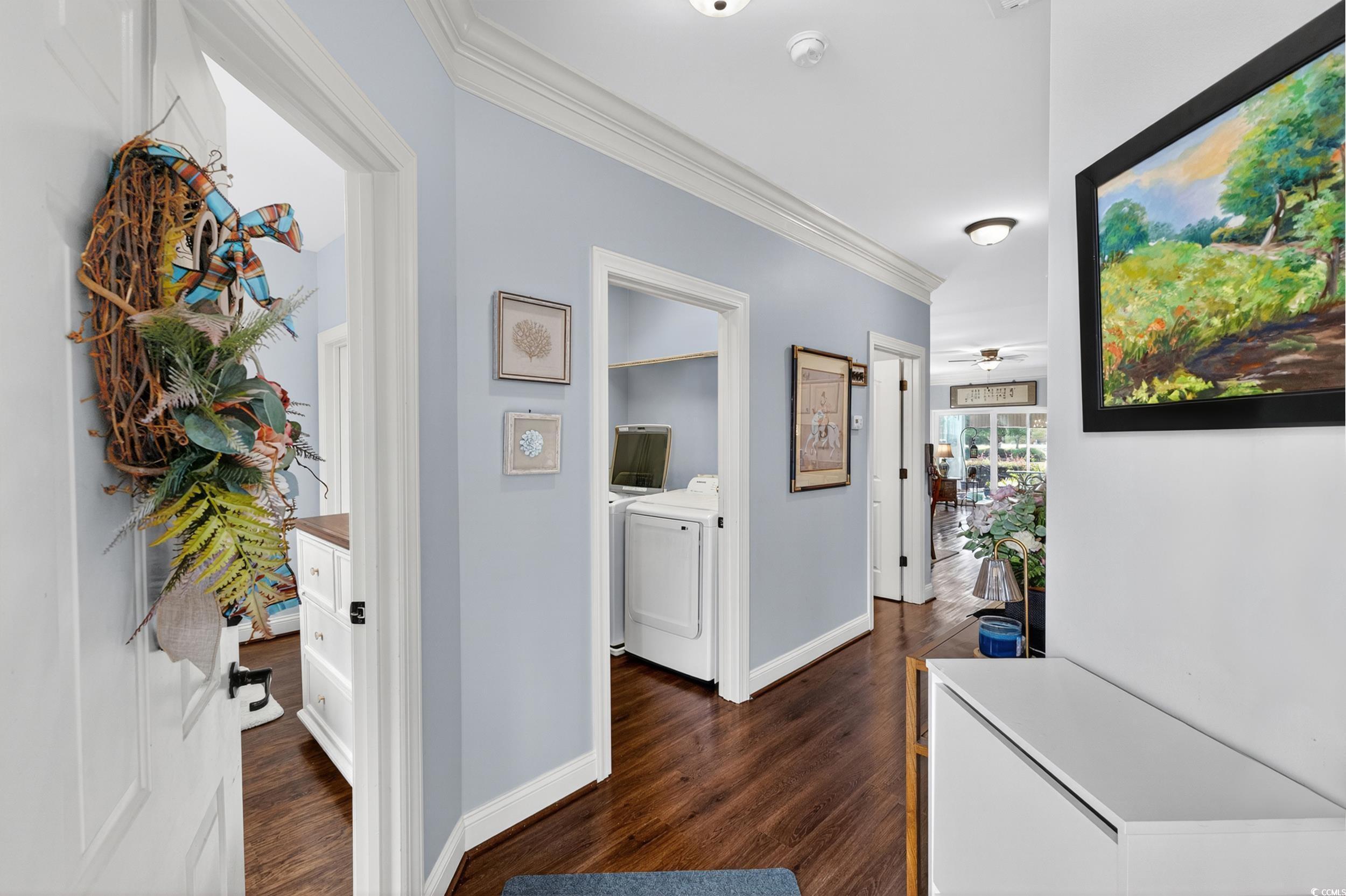Image 3: Corridor with crown molding, dark wood-style floor Image 3: Corridor with crown molding, dark wood-style floor