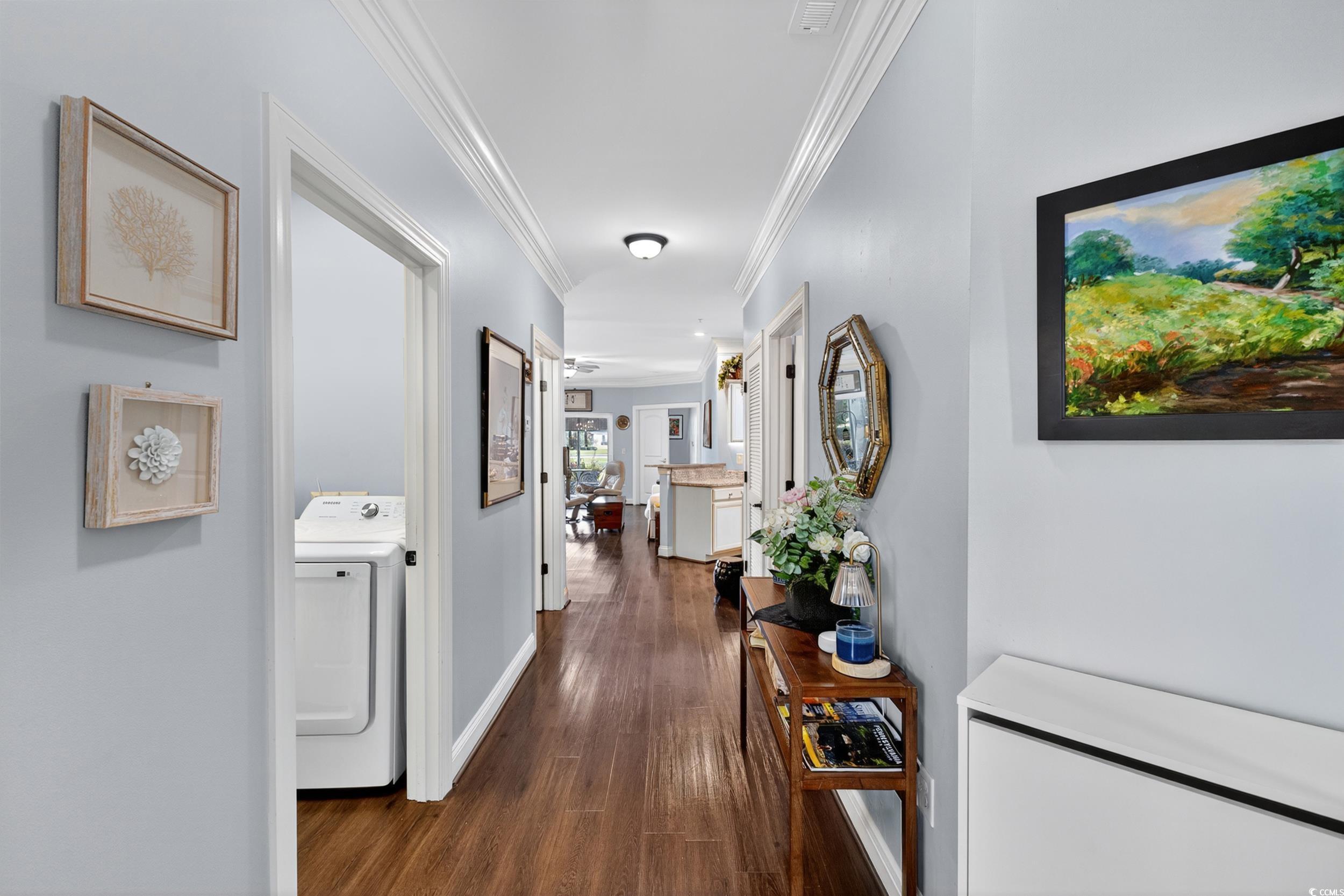 Image 4: Hall featuring washer / clothes dryer, dark wood-s Image 4: Hall featuring washer / clothes dryer, dark wood-s