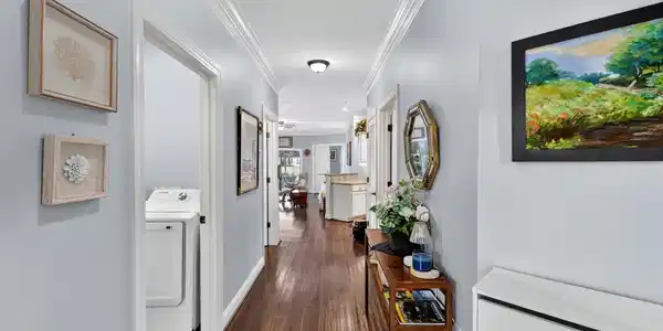 Image 4: Hall featuring washer / clothes dryer, dark wood-s