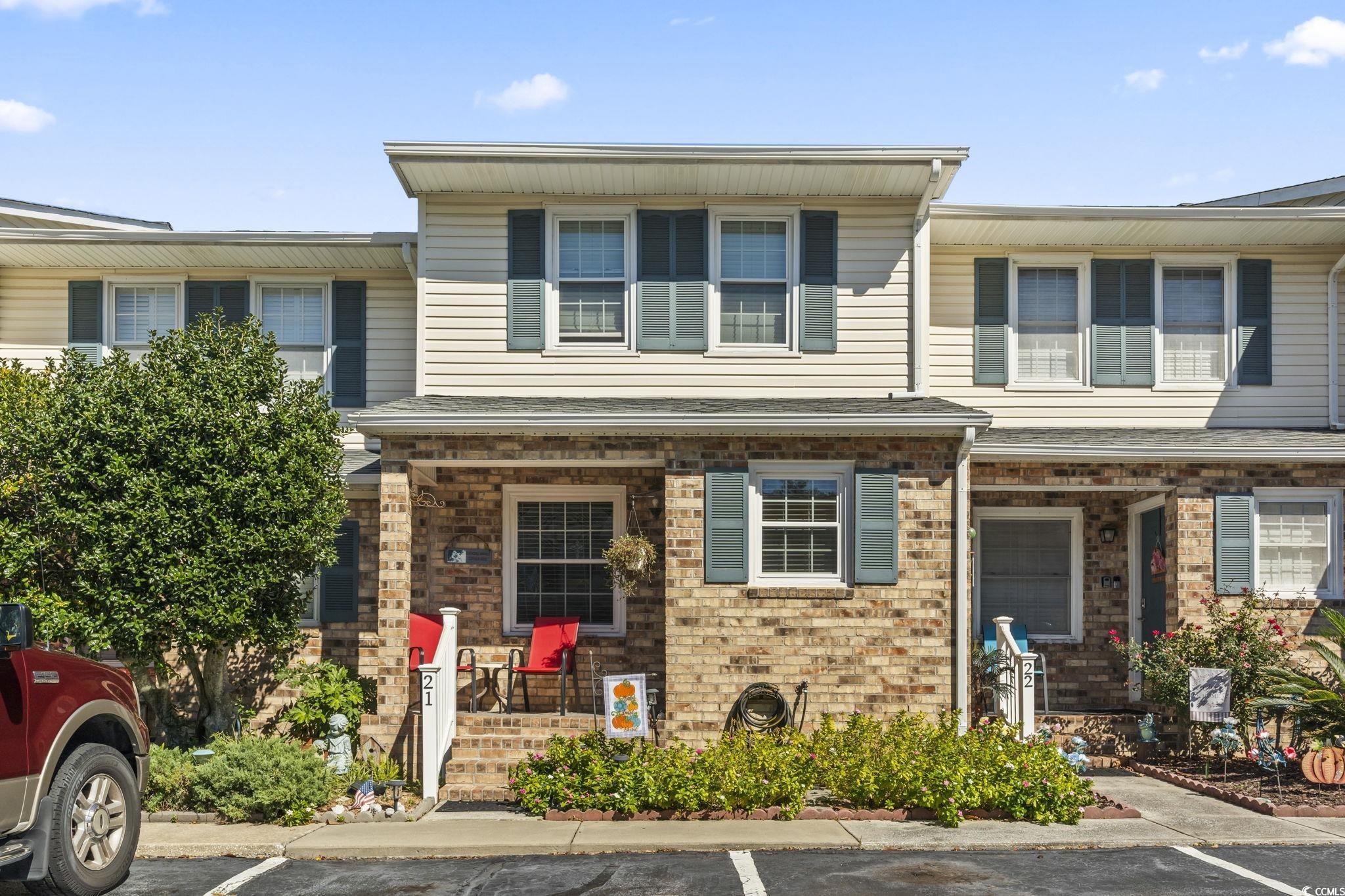 Image 1: View of exterior entry featuring a porch, brick si Image 1: View of exterior entry featuring a porch, brick si
