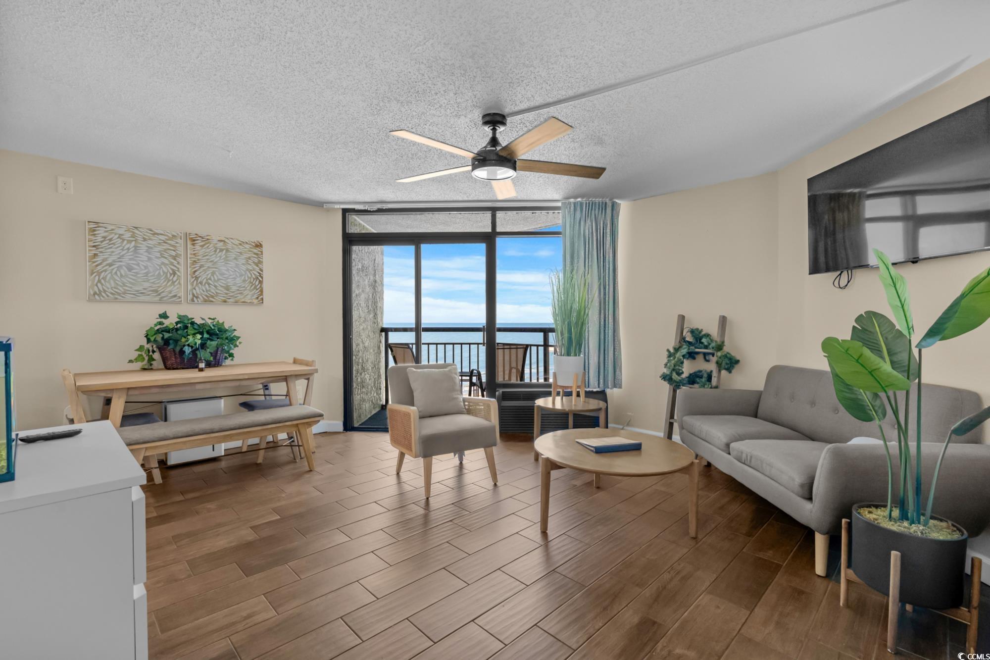 Image 2: Living room featuring wood finish floors, baseboar