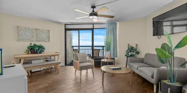 Image 2: Living room featuring wood finish floors, baseboar