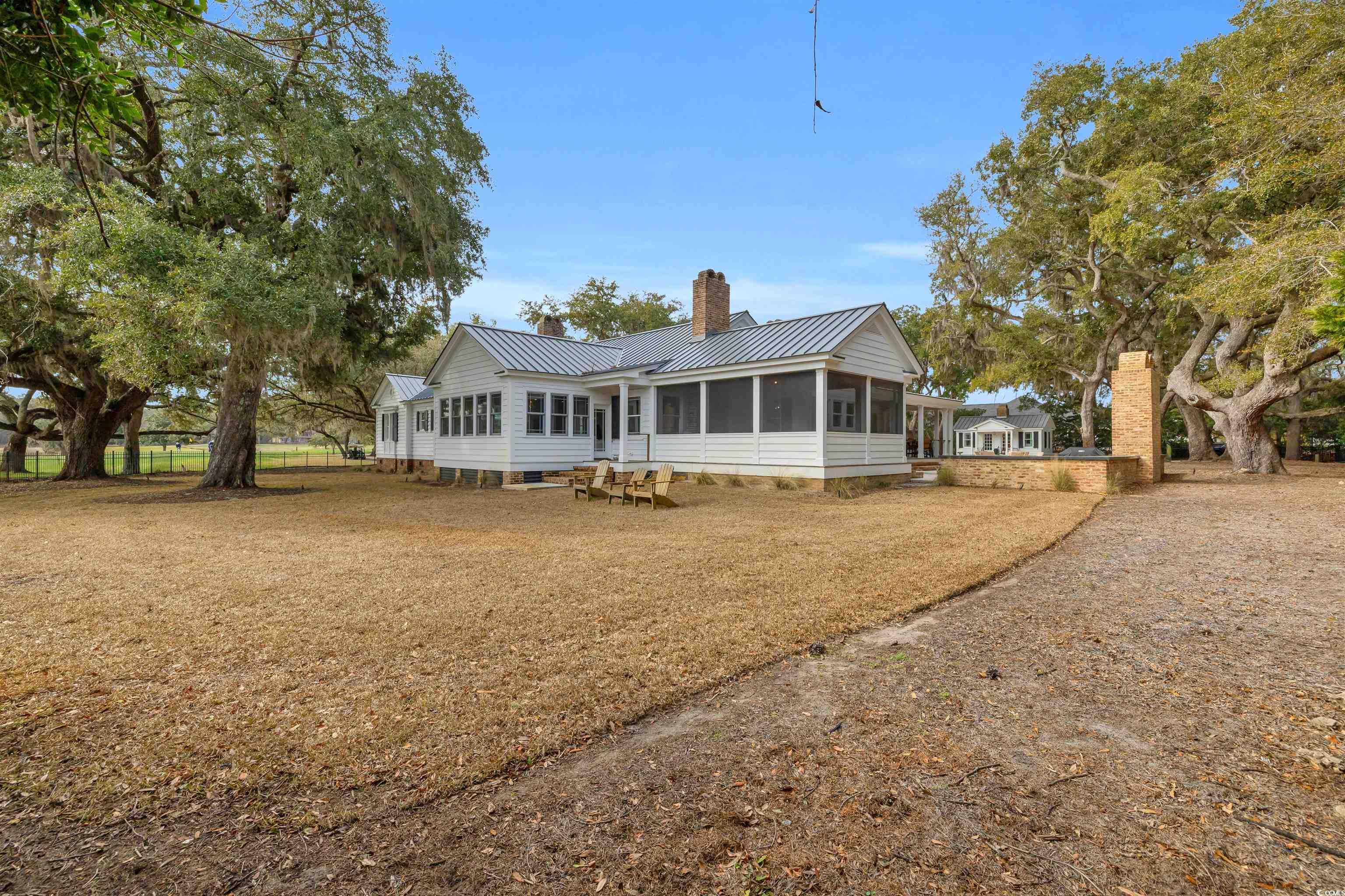 Image 3: Exterior space featuring a sunroom