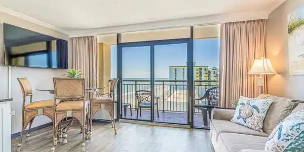 Image 4: Living room featuring floor to ceiling windows, a Image 4: Living room featuring floor to ceiling windows, a