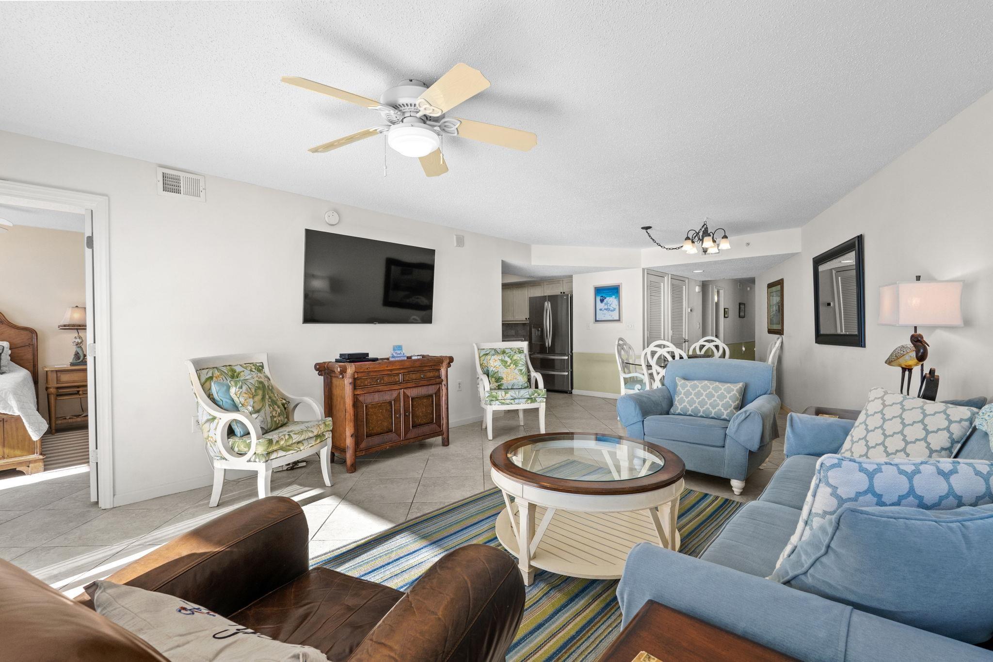 Image 2: Living room featuring a chandelier, tile patterned Image 2: Living room featuring a chandelier, tile patterned