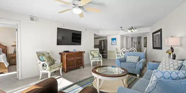 Image 2: Living room featuring a chandelier, tile patterned