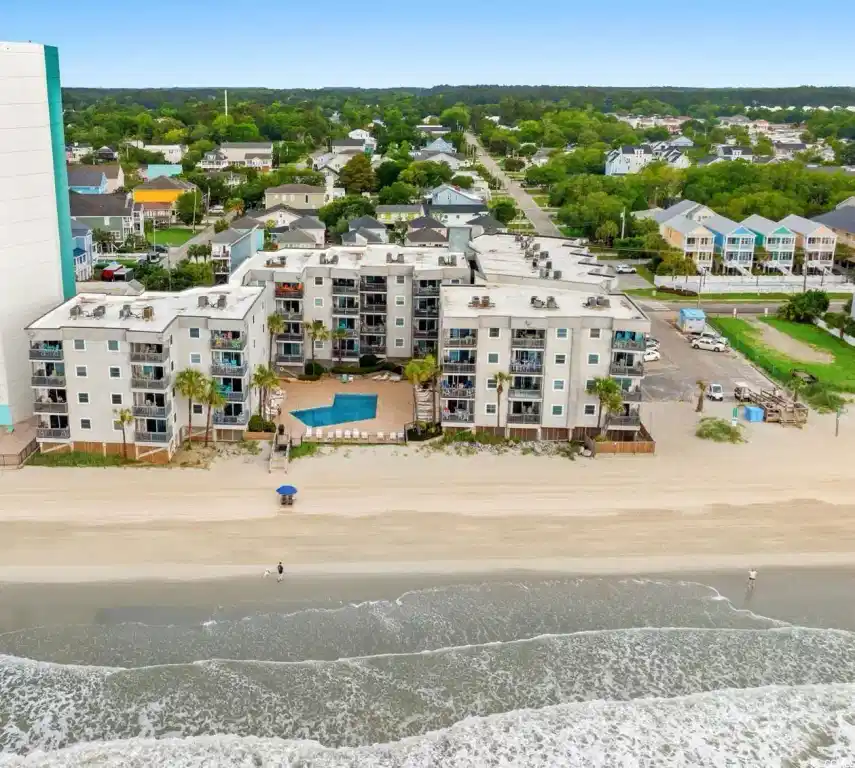 Image 1: Bird's eye view of expansive coastline and apartme Image 1: Bird's eye view of expansive coastline and apartme