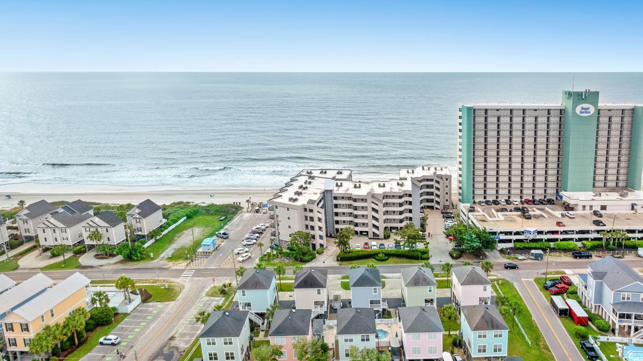 Image 2: Aerial view of waterfront with a beach