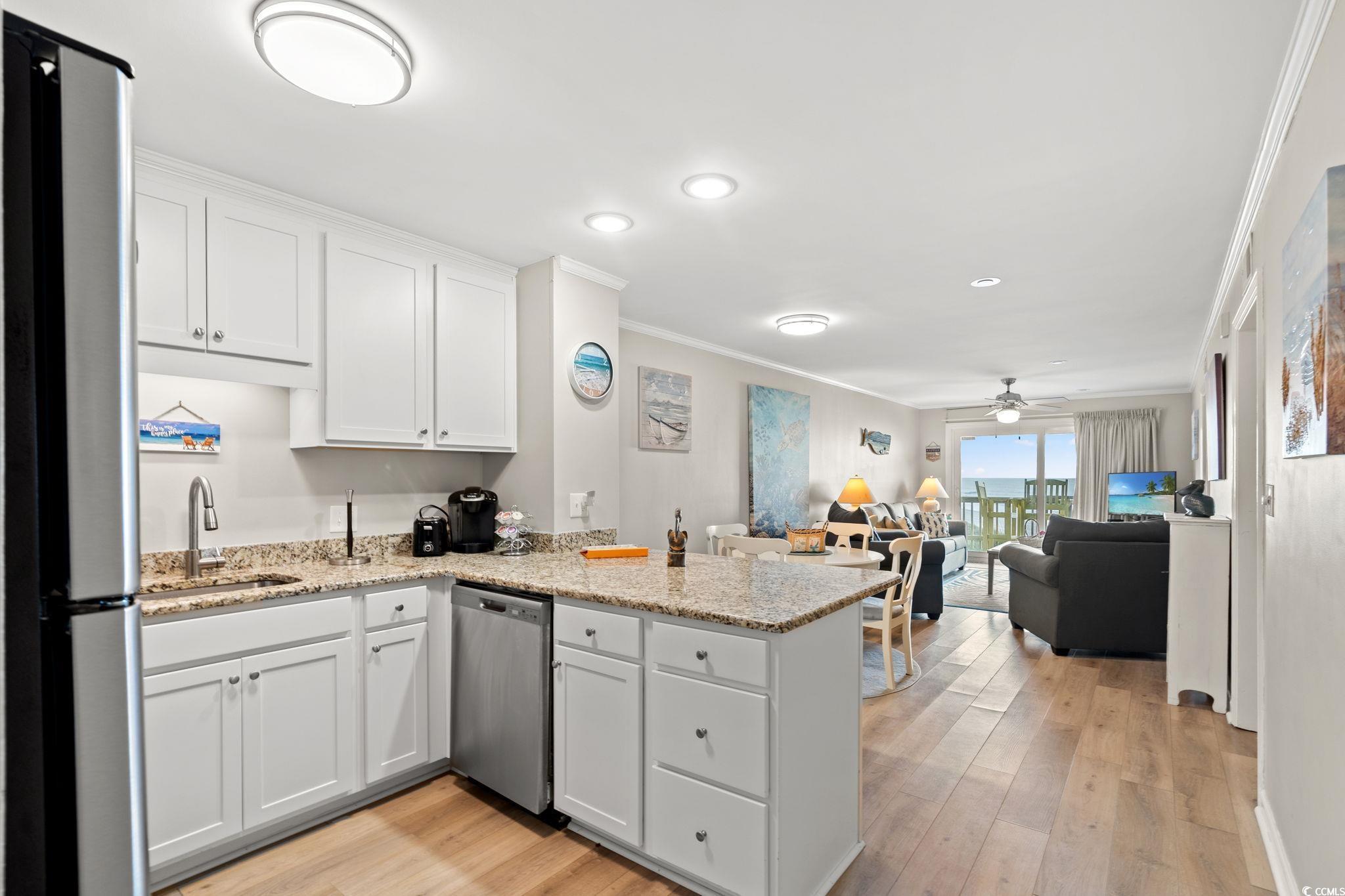 Image 4: Kitchen with appliances with stainless steel finis