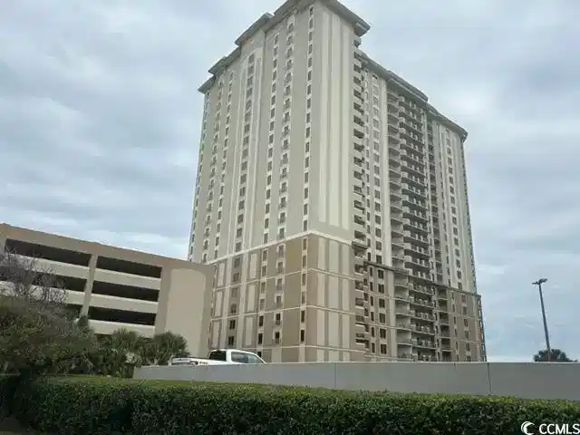 Image 1: View of apartment building / complex
