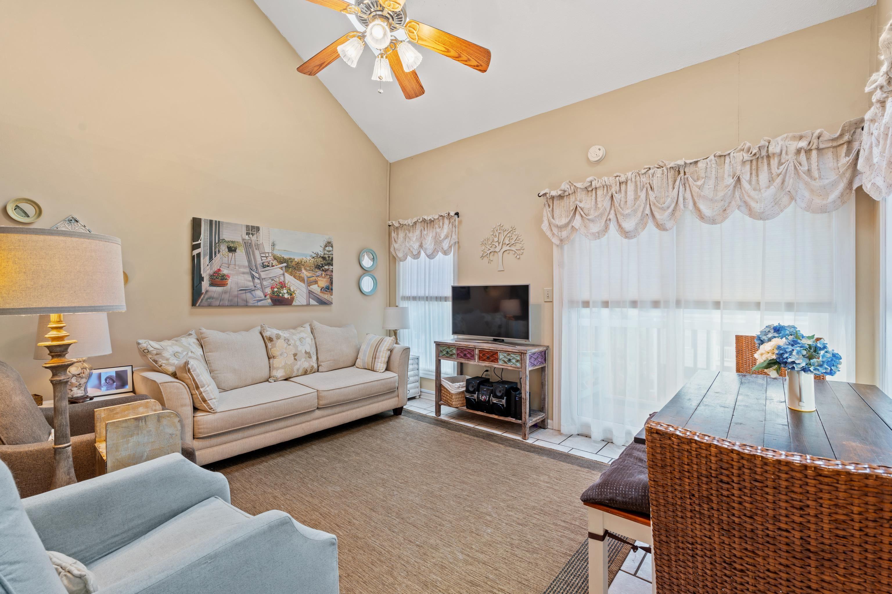 Image 2: Living area featuring high vaulted ceiling and a c Image 2: Living area featuring high vaulted ceiling and a c